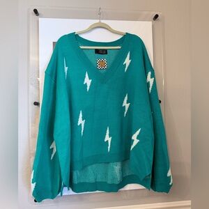 Dressed in LALA Emerald V-Neck Sweater with Lightning Bolts
